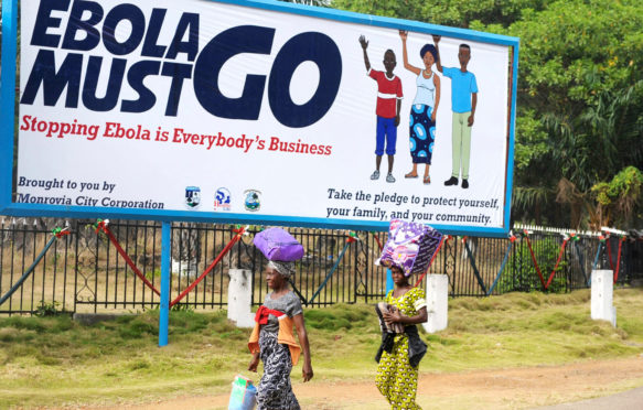 2015年1月15日，利比里亚蒙罗维亚，一个公共服务广告牌，要求所有人帮助阻止埃博拉爆发。资料来源：联利特派团/阿拉米库存照片。F155K4